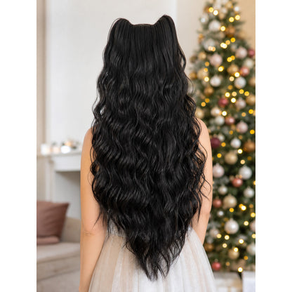 Costume beard in long black wavy fibers, shown from the back on a person in front of a decorated tree