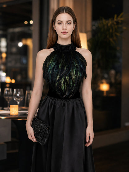 Black feather halter top with a beaded high collar, shown on a model in a restaurant setting with a black skirt and clutch