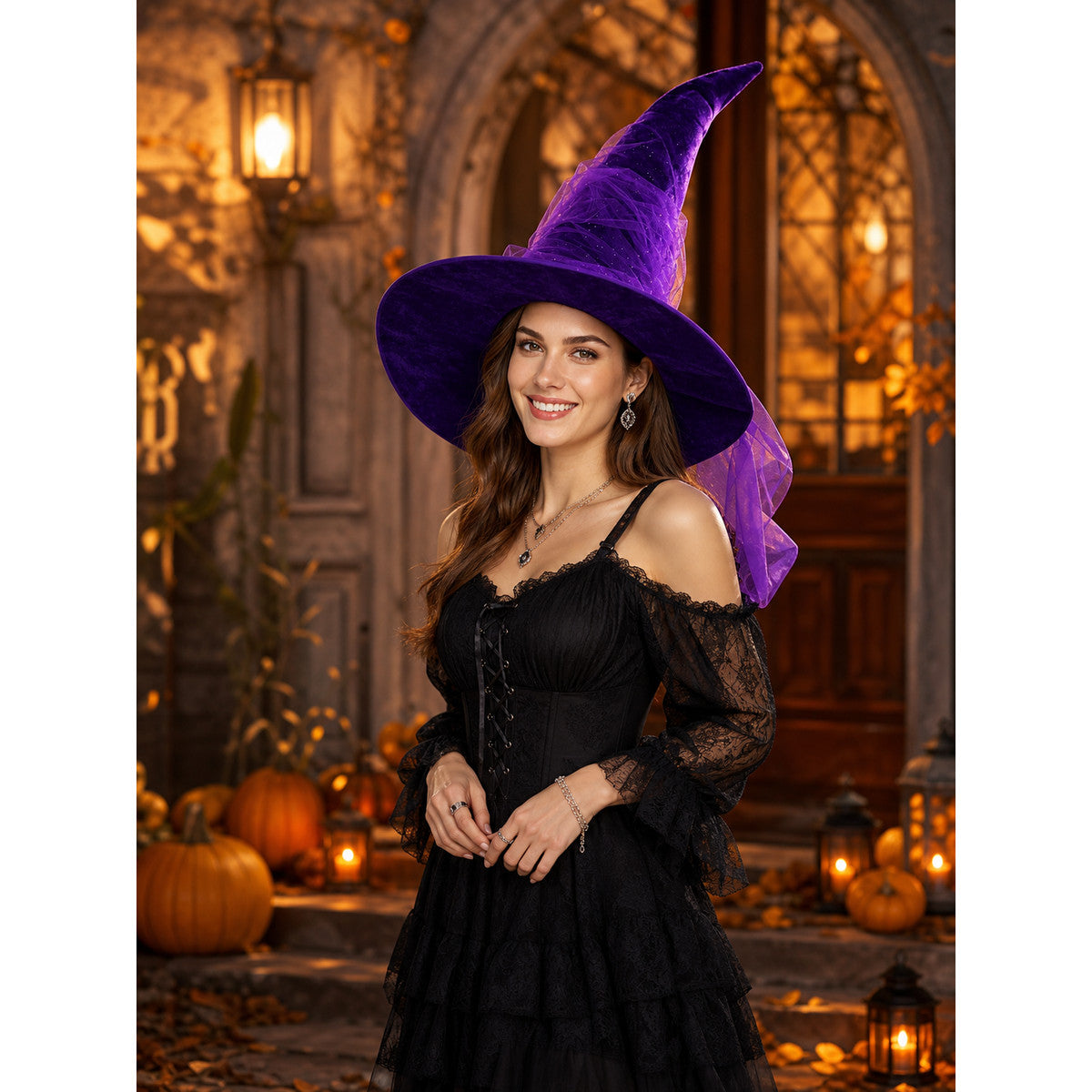 Purple witch hat with curved pointed crown and trailing sheer veil styled with a black lace dress at a Halloween doorway