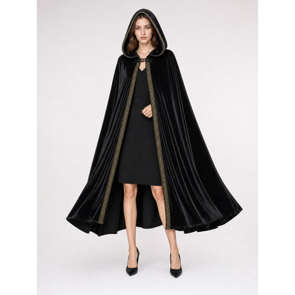 Black hooded cloak shown full-body on a model, with a flared drape, glossy velvet-look fabric, and decorative front trim