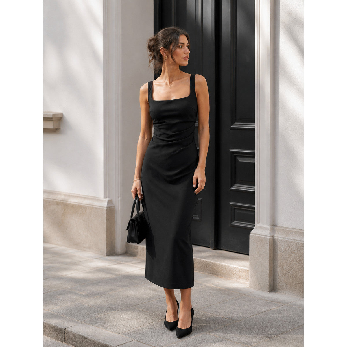 Black midi dress with a square neckline and draping