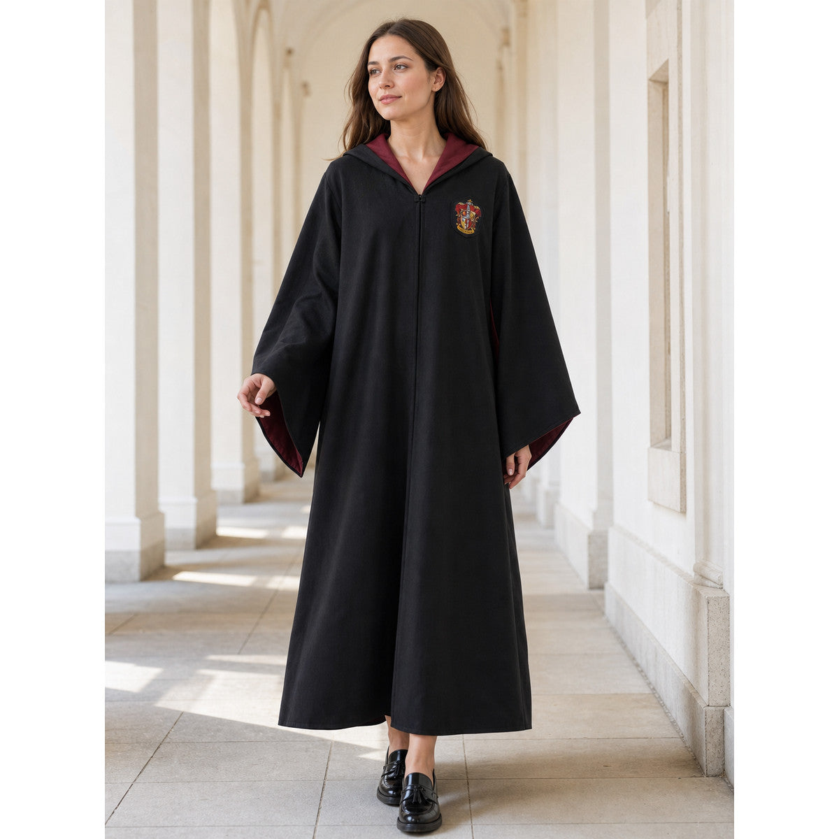 Black wizard cloak with emblem and wand lifestyle view