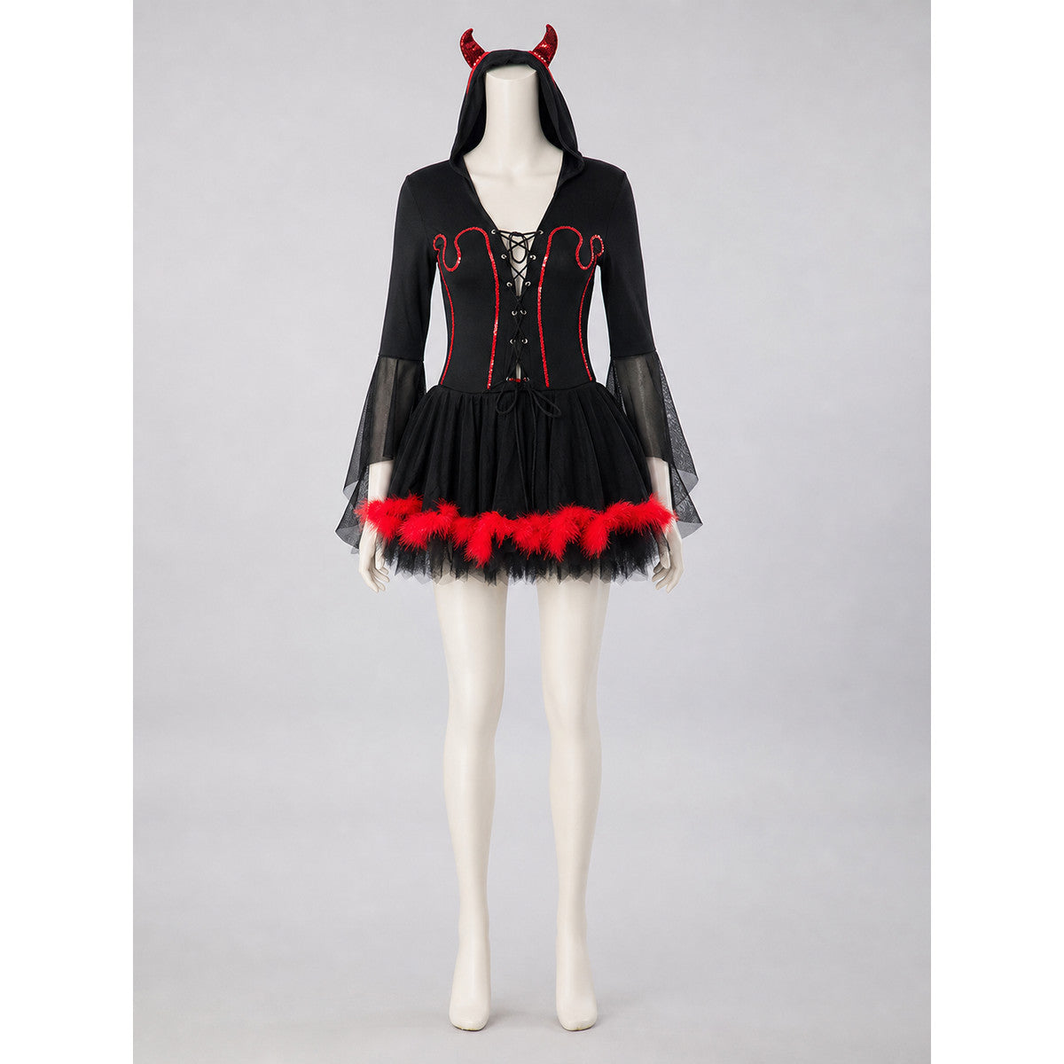 The magic of the look is revealed in the details of this costume: a black dress-style base is complemented by red accents and contrasting elements. The front features crisscross lacing and red trim that emphasizes the garment’s construction