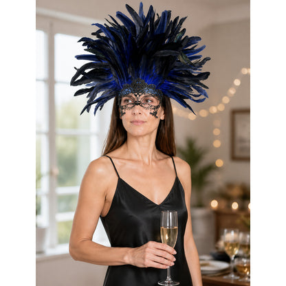 Blue and black feather headpiece with a black filigree eye mask, shown on a model wearing a black satin slip dress