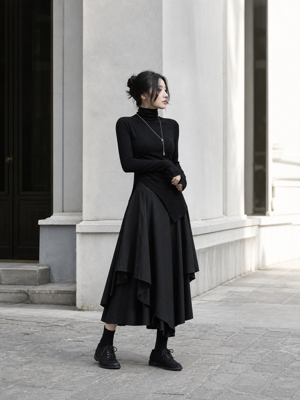 Women's Black Long Skirt with an Asymmetrical Hem product detail