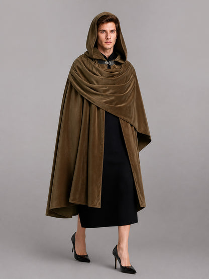 Brown velvet-look hooded cloak shown full-length on a model, with the hood raised, layered draping, and a front clasp