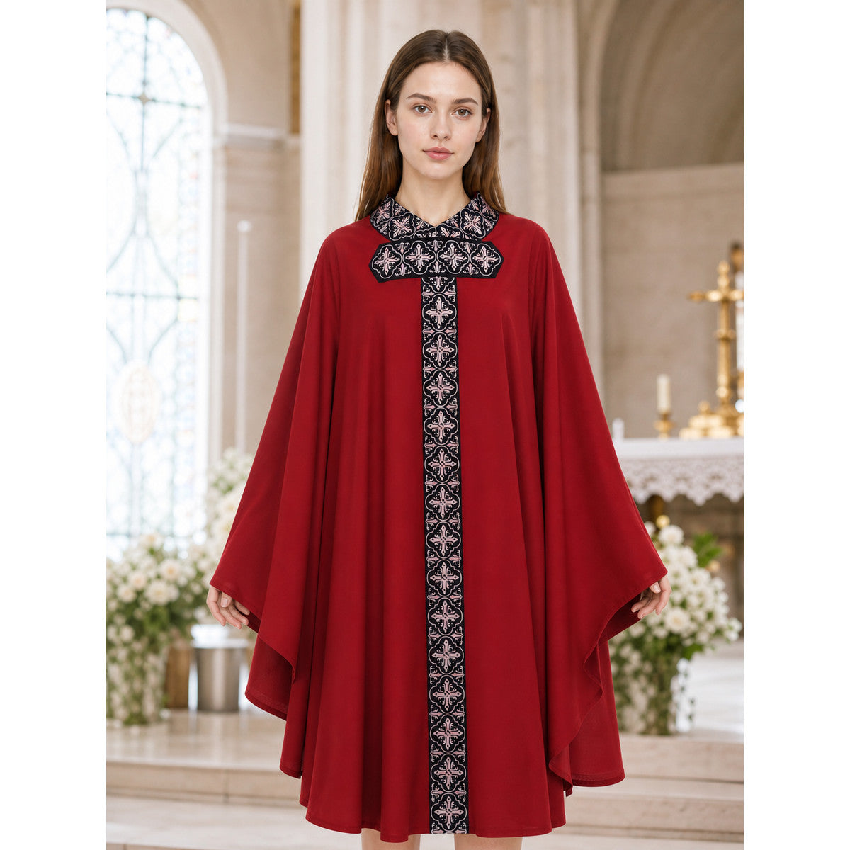 The cape is red with black decorative elements. It has a loose cloak-style silhouette, wide sleeves, and a collar with black patterned detailing. The front features a vertical decorative stripe down the center and a horizontal stripe across