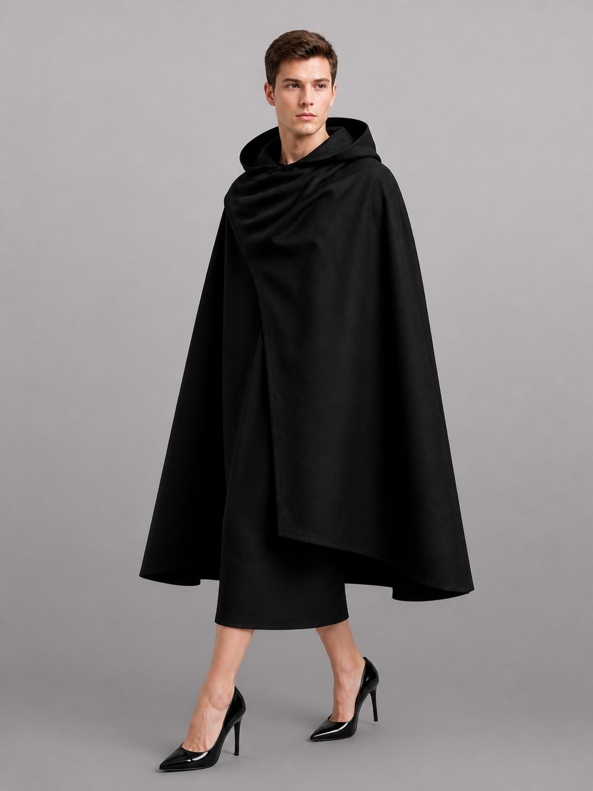 Black hooded cloak shown full-length from the front on a model, with a wide draped body and open front