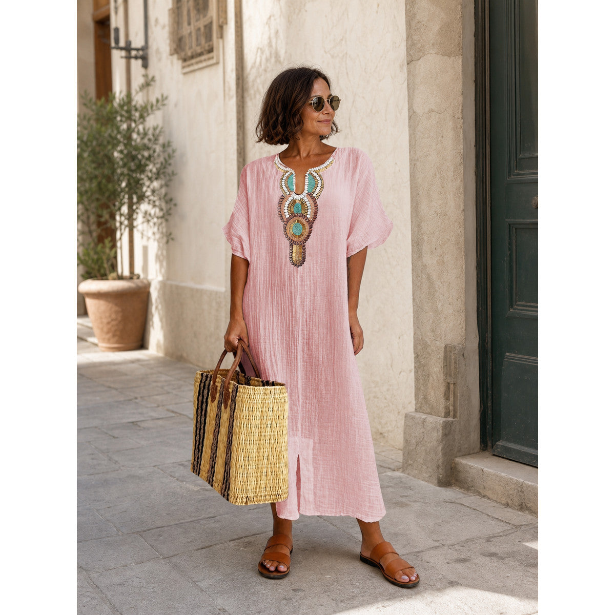 Pink loose-fit midi dress with embroidery and a slit