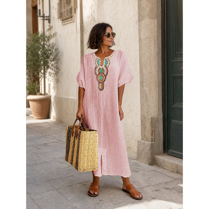 Pink loose-fit midi dress with embroidery and a slit