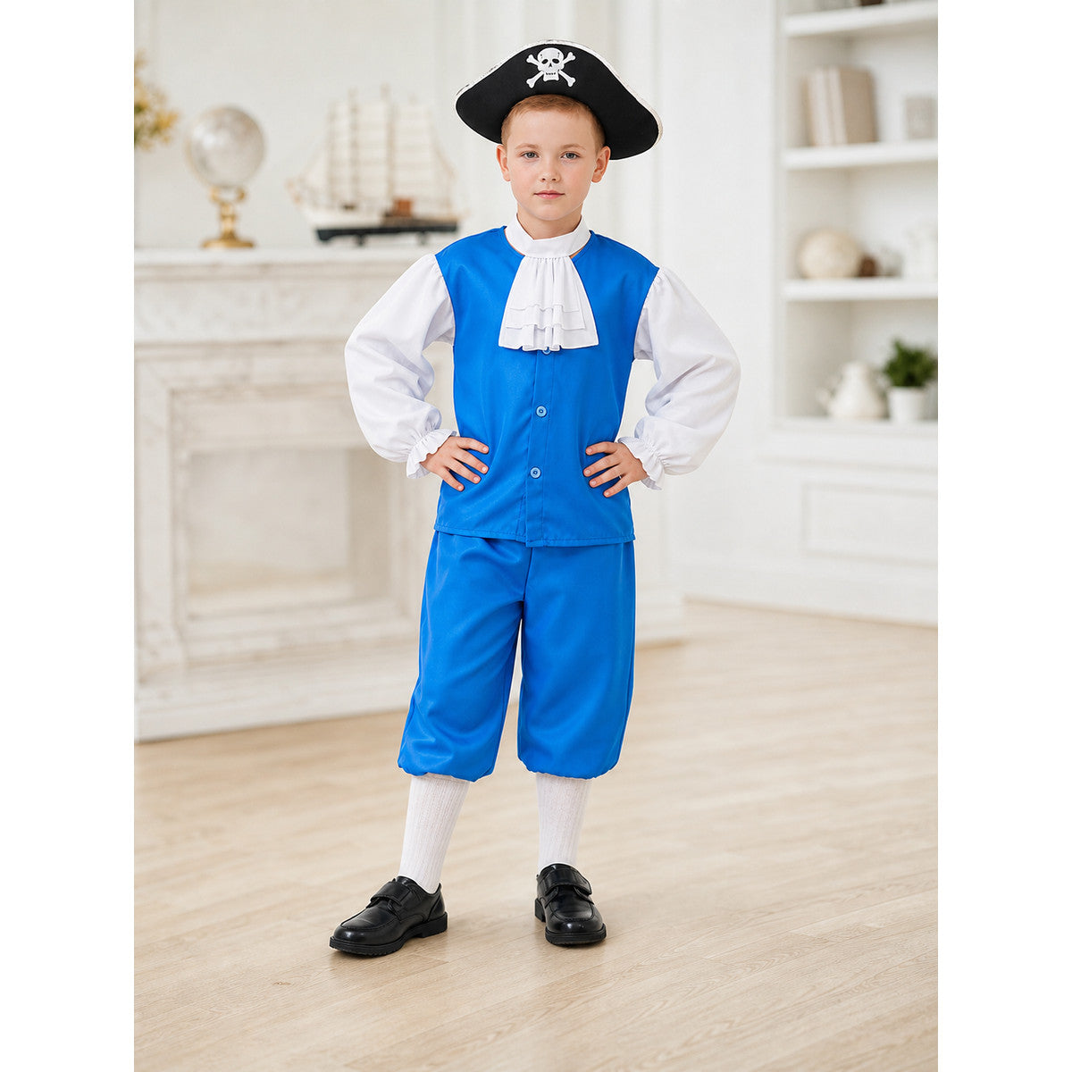 Boy in the blue pirate captain costume with black skull-and-crossbones tricorn hat, hands on hips