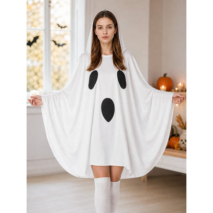 White hooded ghost cape shown full-body in a Halloween-themed room, with wide sleeves and black patches