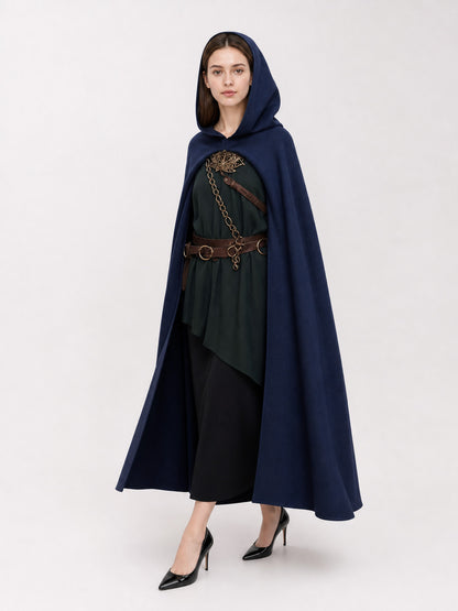 Navy hooded costume cloak shown full-length on a model with the hood up, worn over a dark green tunic with a brown belt