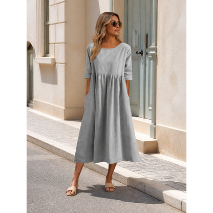 Long gray dress with 3/4 sleeves and an A-line silhouette