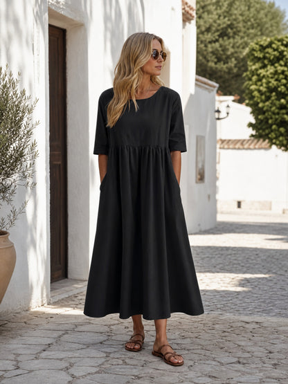 This black long dress features a round neckline, elbow-length sleeves, and a Costume Dresses detail