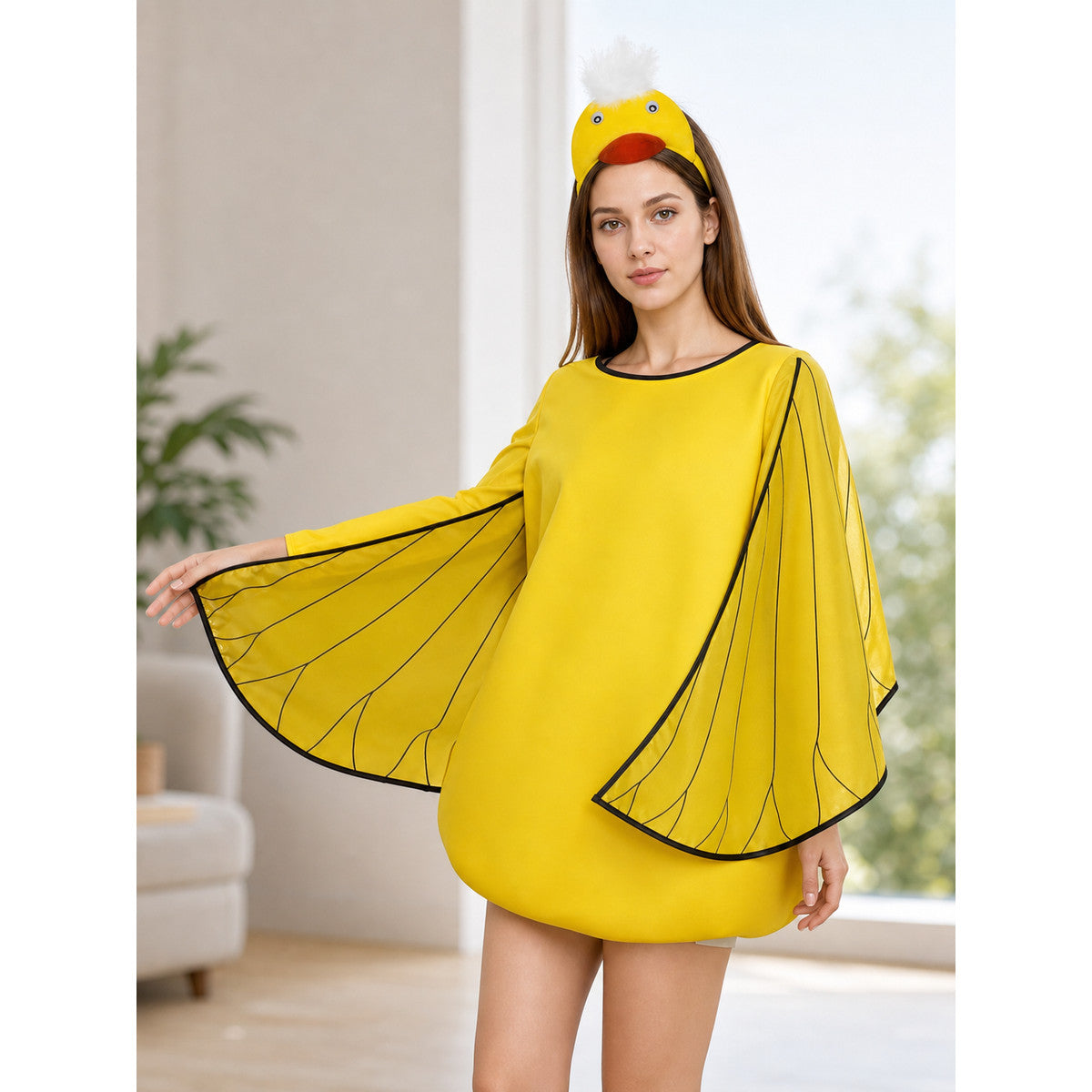 Three-quarter indoor view of a bright yellow costume with wing-shaped sleeves and a duck headband