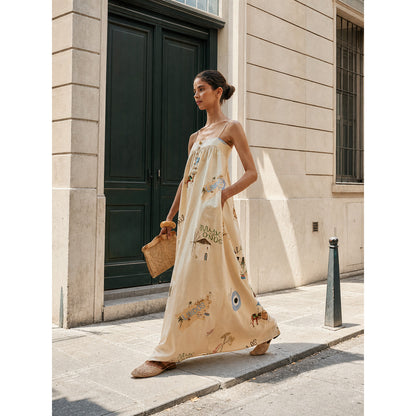 Long dress with thin straps, a print, and buttons
