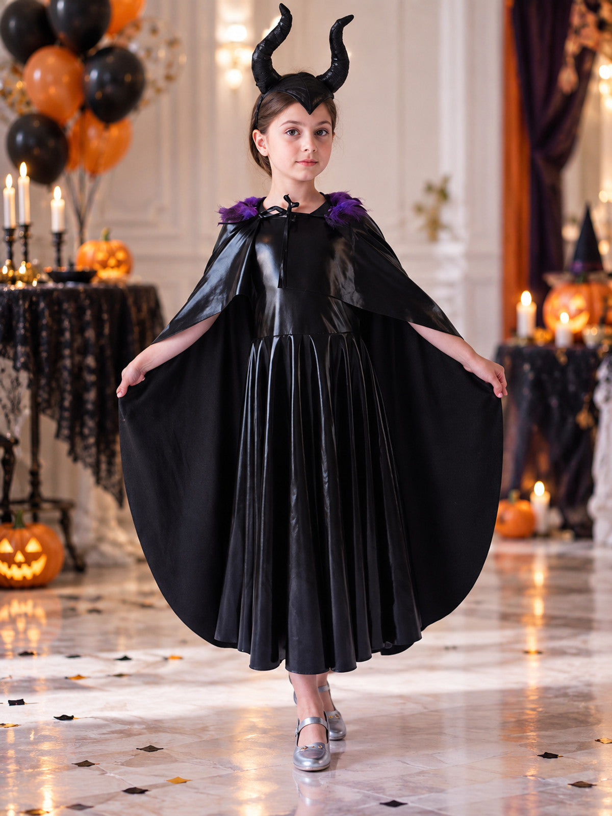 Costume: black dress, cape, headband with horns