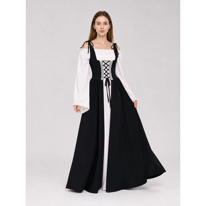 The dress is designed in a vintage medieval style and features characteristic elements of Renaissance-era clothing. The main part of the design is black, while the white details create a striking contrast. The fitted black bodice features a