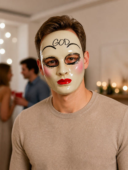 White glossy masquerade mask worn by a model in a styled indoor scene, showing black eye details, pink cheeks, red lips, and forehead lettering