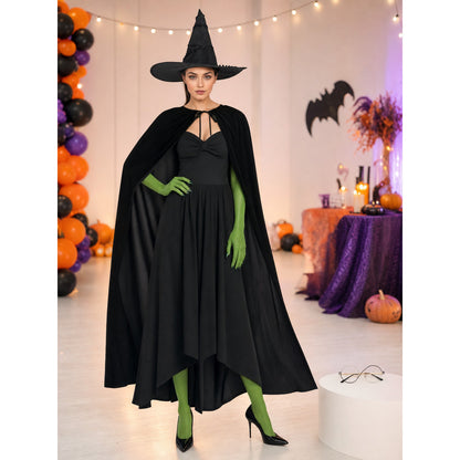 Black costume cape and bright green gloves on a full-body model in a decorated Halloween party setting