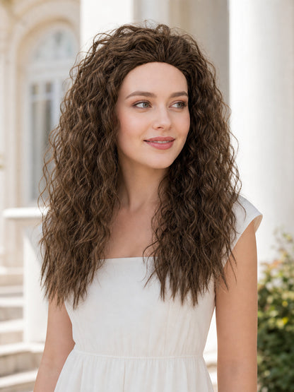 Long brown curly hair accessory shown on a woman in a white dress in an indoor setting