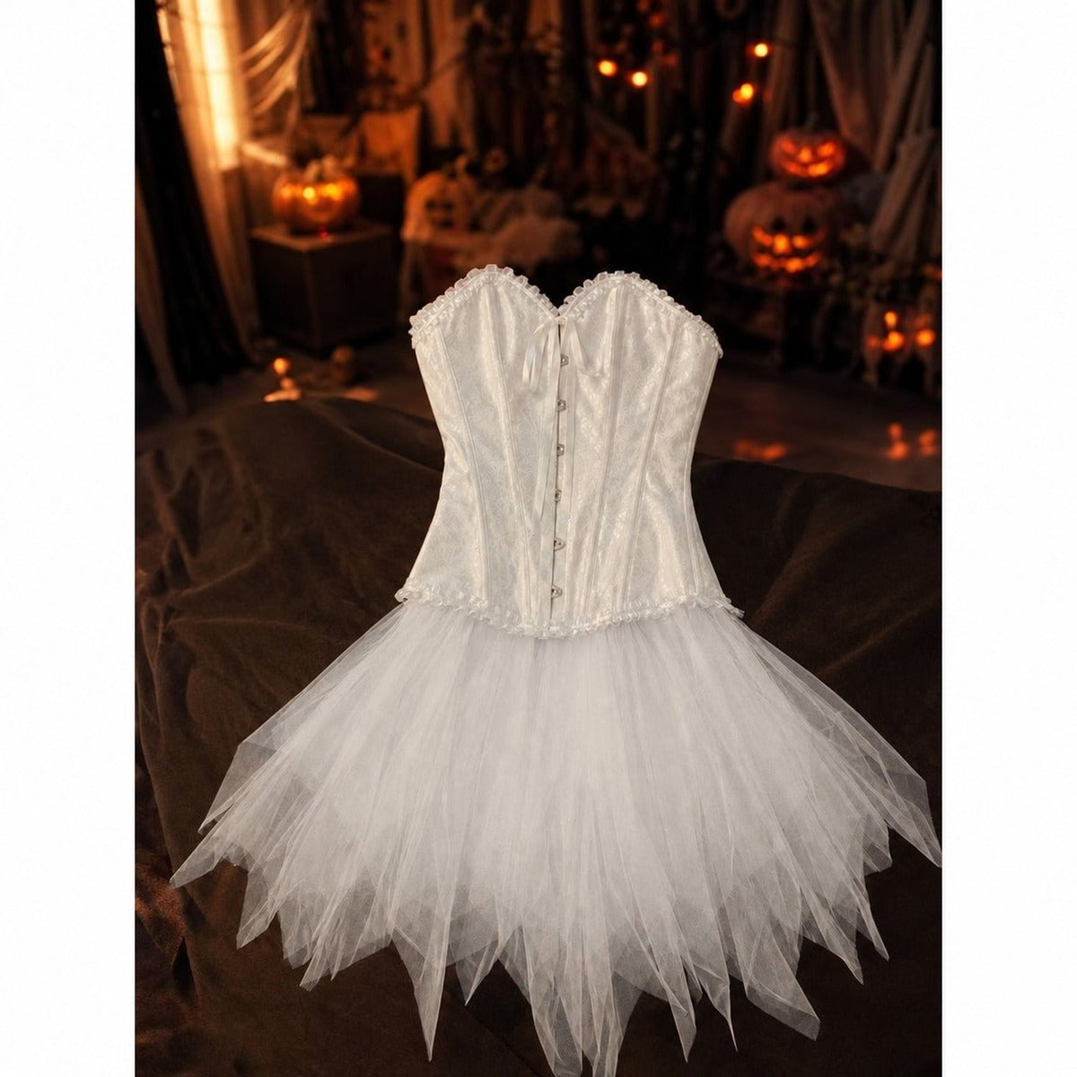What's included: white corset top and white layered tulle skirt laid flat