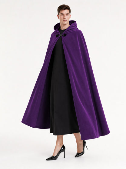 Purple hooded cape with black front clasp shown full length on a model, worn open over a black outfit