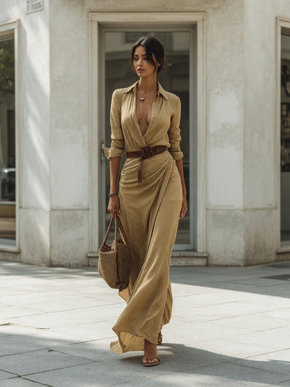 The dress features a long khaki silhouette with long sleeves, a shirt-style Costume Dresses detail