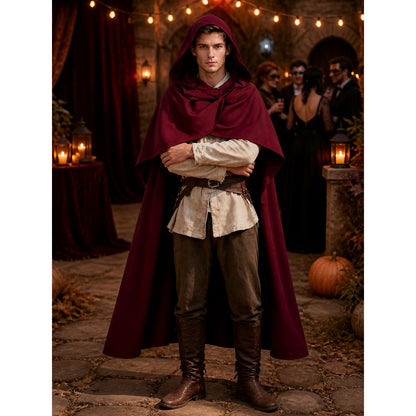 Wine red hooded cape with a draped overlap front, shown full-body on a model in a medieval-style outfit at an outdoor evening gathering