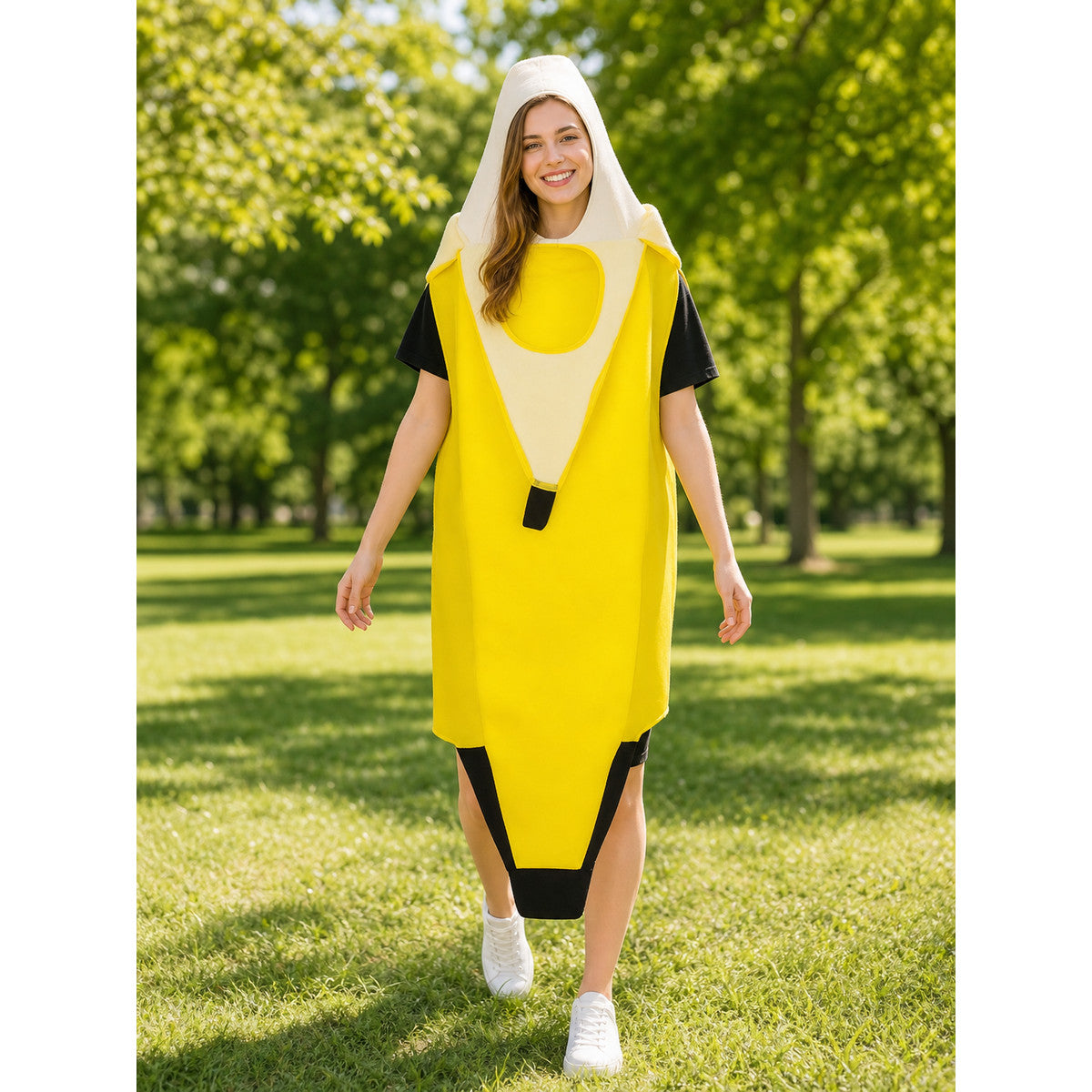 Yellow banana costume with a white hood and black trim, shown full-body on a woman outdoors over a black shirt and white sneakers