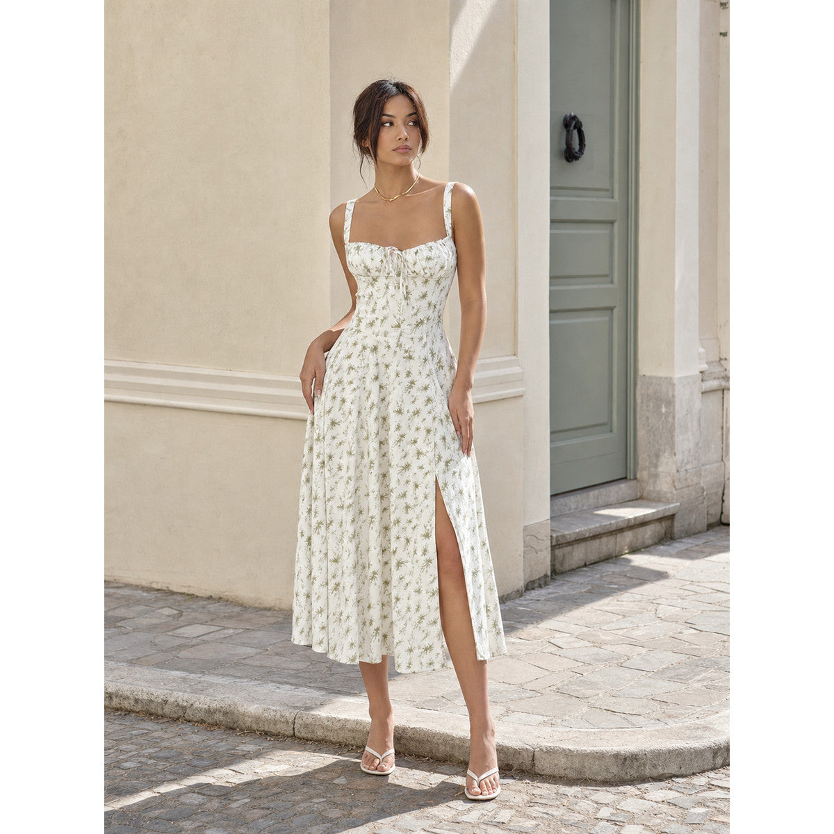 Lightweight midi dress with thin straps, floral print, slit, and fitted silhouette