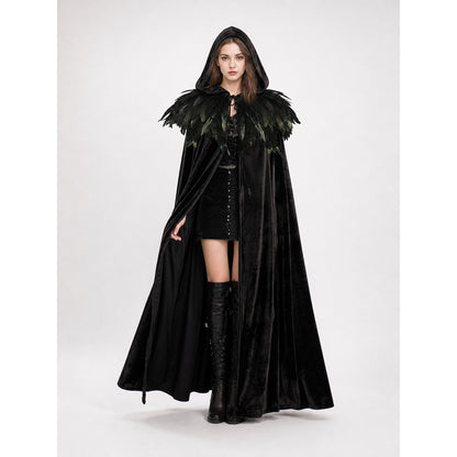 Black velvet cape on a full-body model wearing the hood up, with layered black feathers around the shoulders