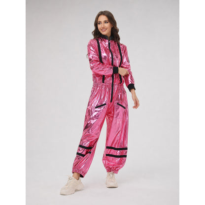 The pink NASA astronaut costume is designed as a one-piece jumpsuit with long sleeves, a stand-up collar, and a central zip closure. The model is pink with black decorative elements: a vertical stripe on the front, zippered side pockets, ho