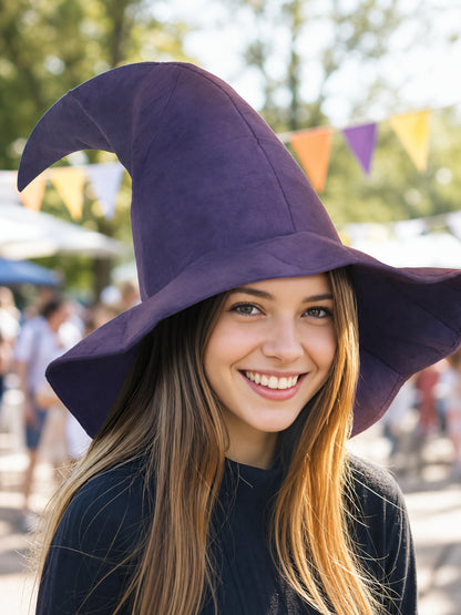 Purple fabric witch hat with a curved pointed crown and wide brim, shown in a close-up outdoor portrait