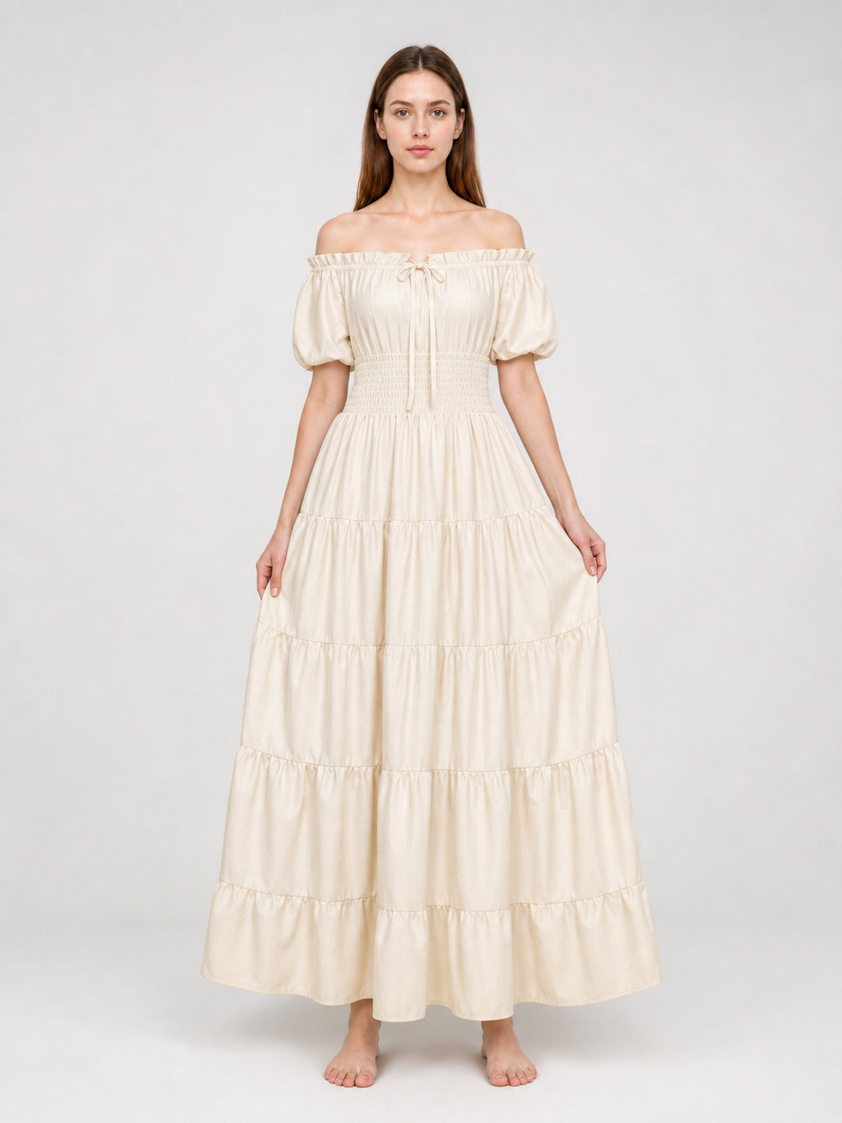 Cream off-shoulder tiered maxi dress with elasticized bodice and short puff sleeves, shown full-body on a model