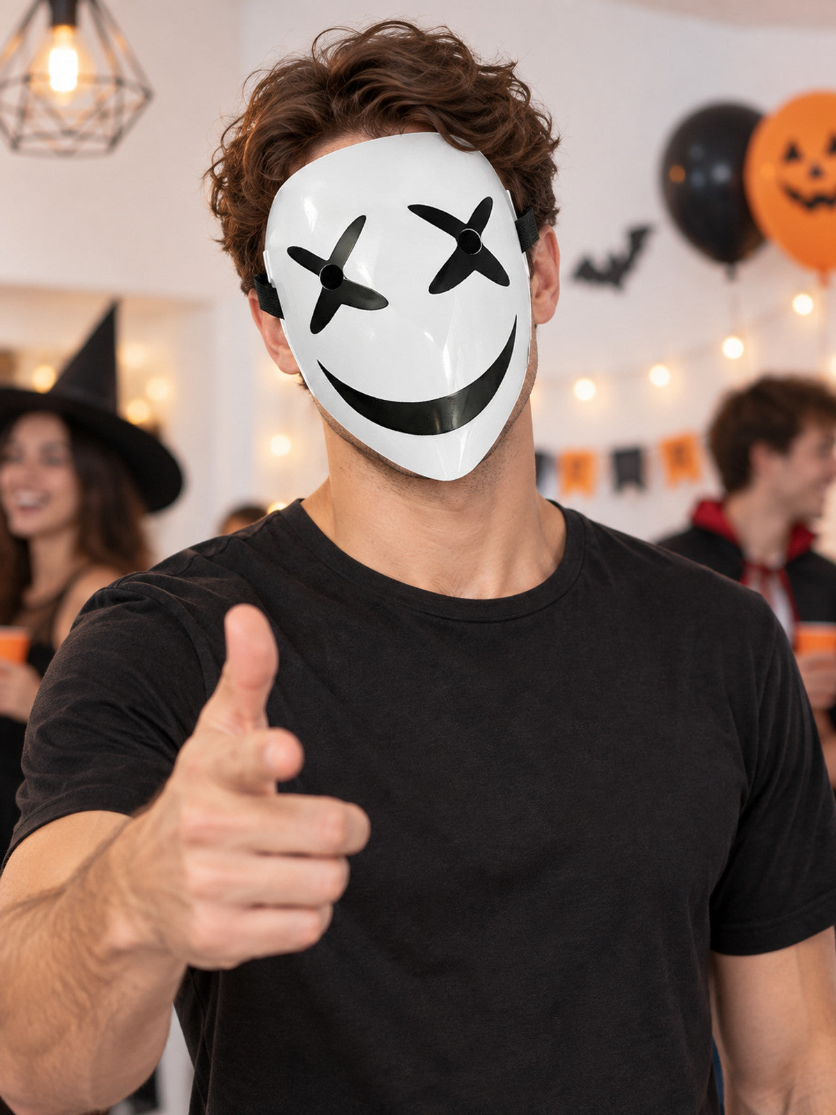White mask with a black smile and cross-shaped eyes