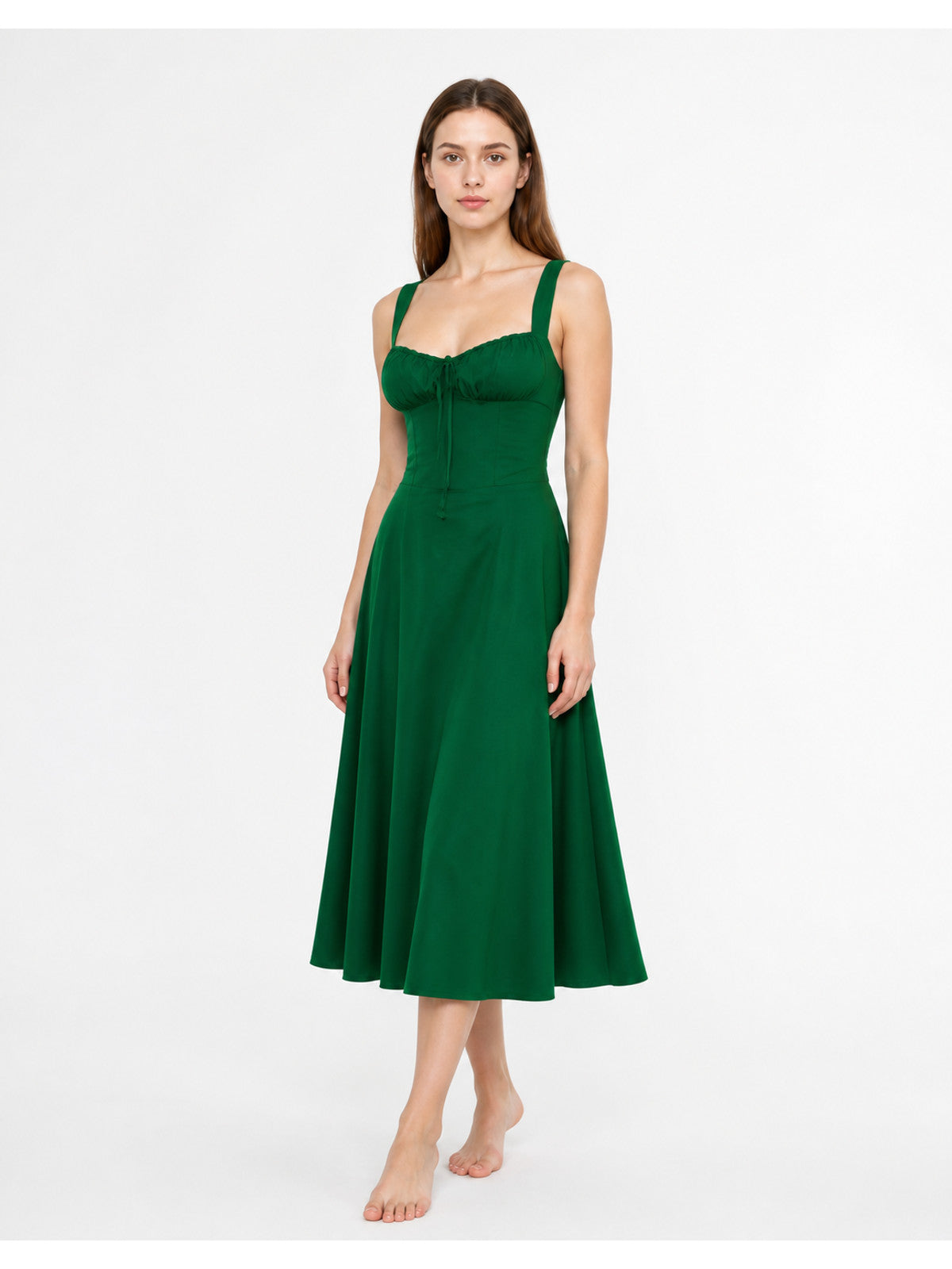 Green dress with thin straps and a square neckline