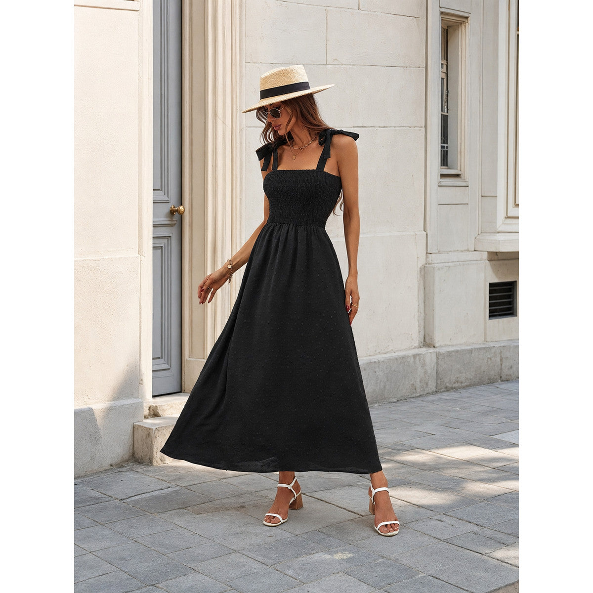 Women's black maxi dress with straps and a square neckline