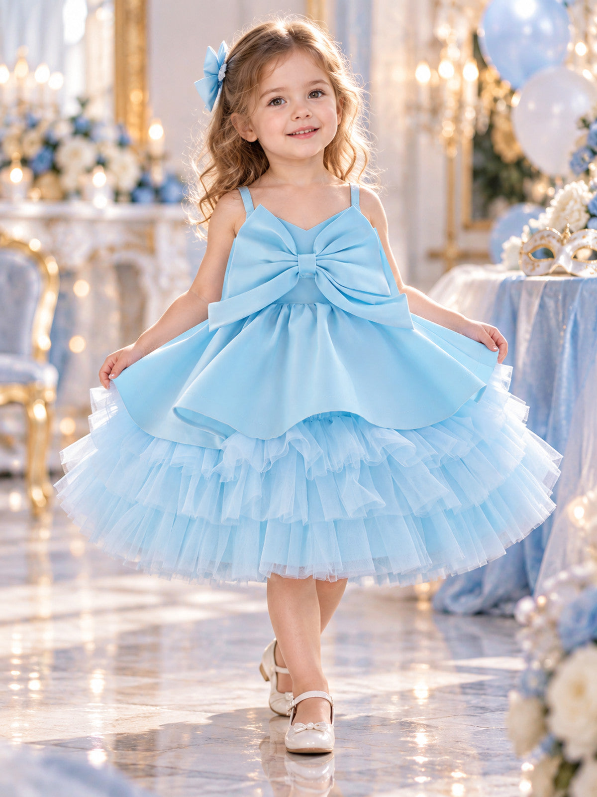 Blue children's holiday dress with a bow and a puffy skirt