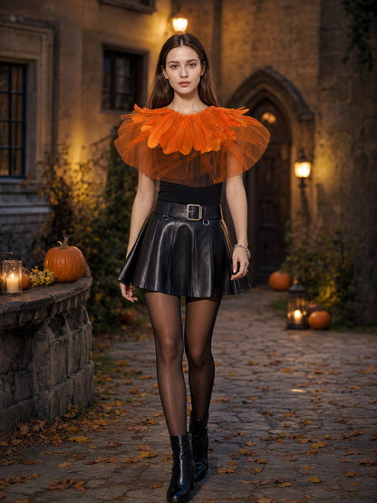 Orange feather and sheer mesh shoulder cape shown on a model in a styled outdoor scene with a black skirt and boots