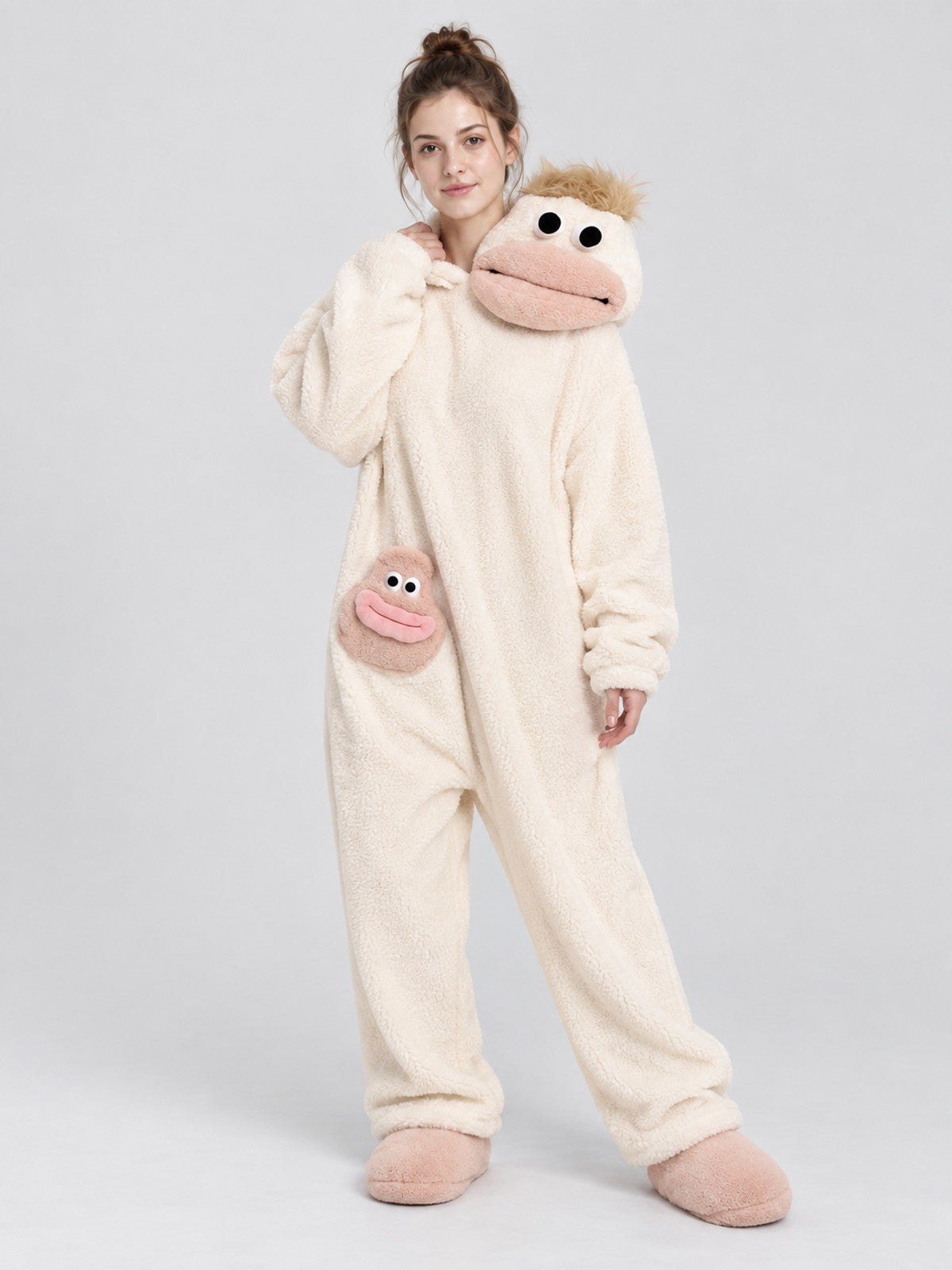 Pajama jumpsuit with a bulky hood and a cartoon face