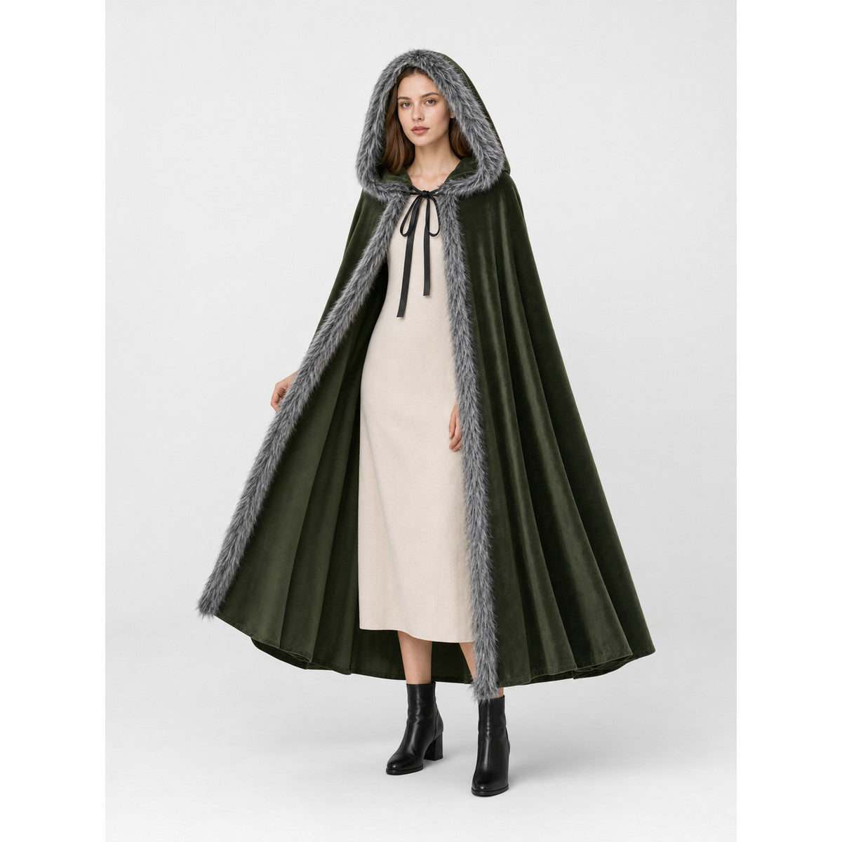 Olive green hooded cape with gray faux-fur trim and tie closure, shown full-length over a light dress