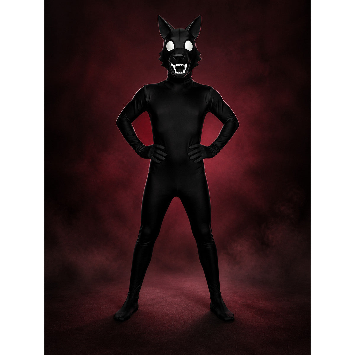 Black wolf bodysuit Halloween costume with wolf-head hood worn hands on hips against a dark red backdrop