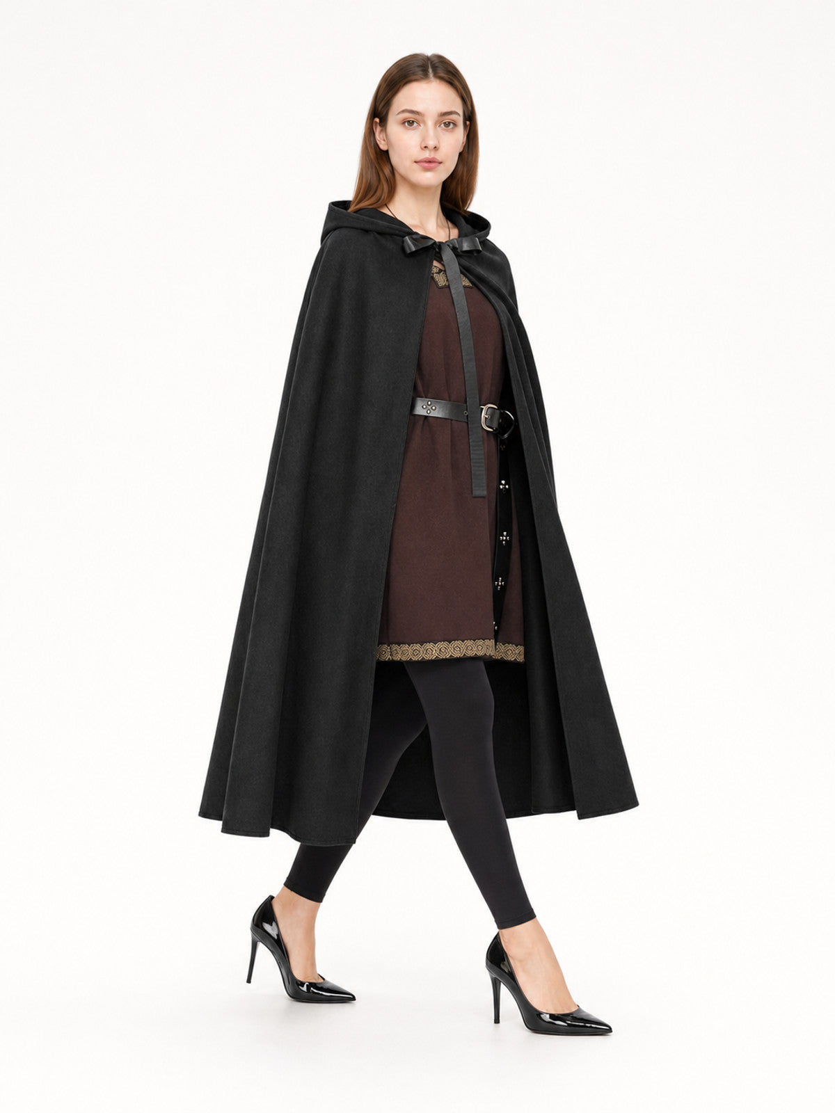 Black hooded cloak shown on a model from a front angle, with a bow tie closure and flowing full-length panels