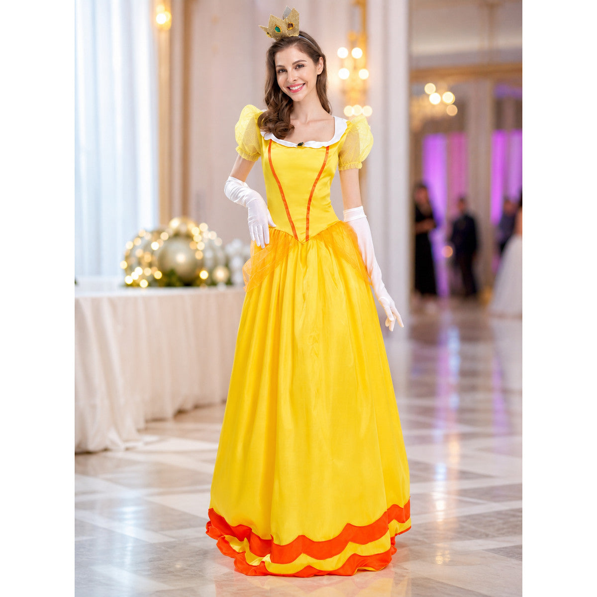 The princess costume features a festive style with distinctive details. The look is centered around a yellow dress with a fitted bodice and full skirt. Symmetrical orange decorative lines on the chest accent the bodice design. A white colla