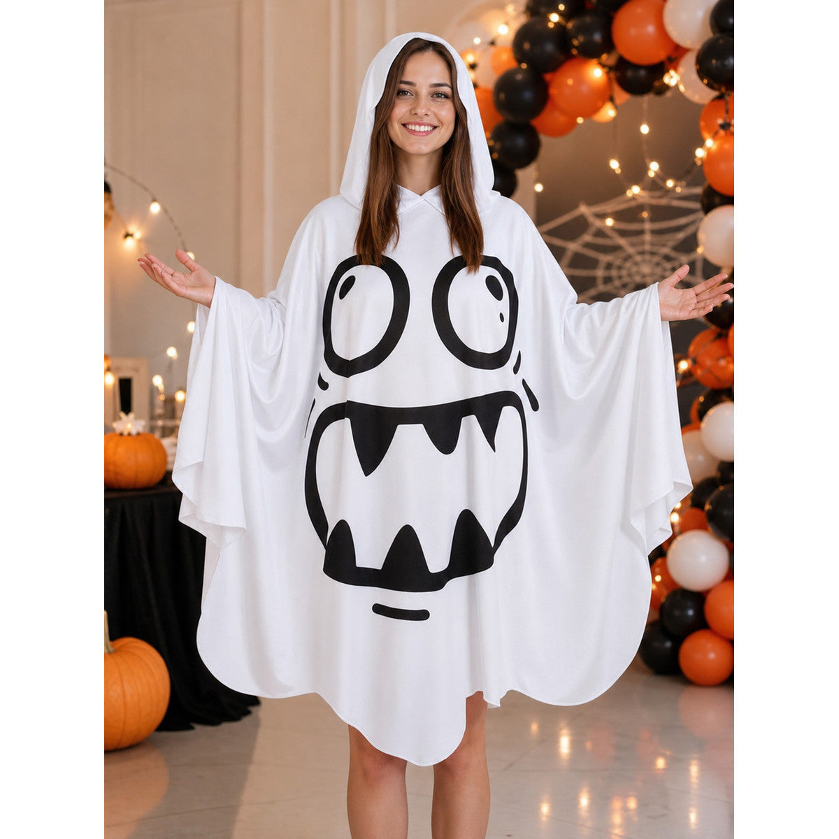 White hooded poncho costume with a black cartoon ghost face and flowing sleeves, shown full-body at a Halloween party