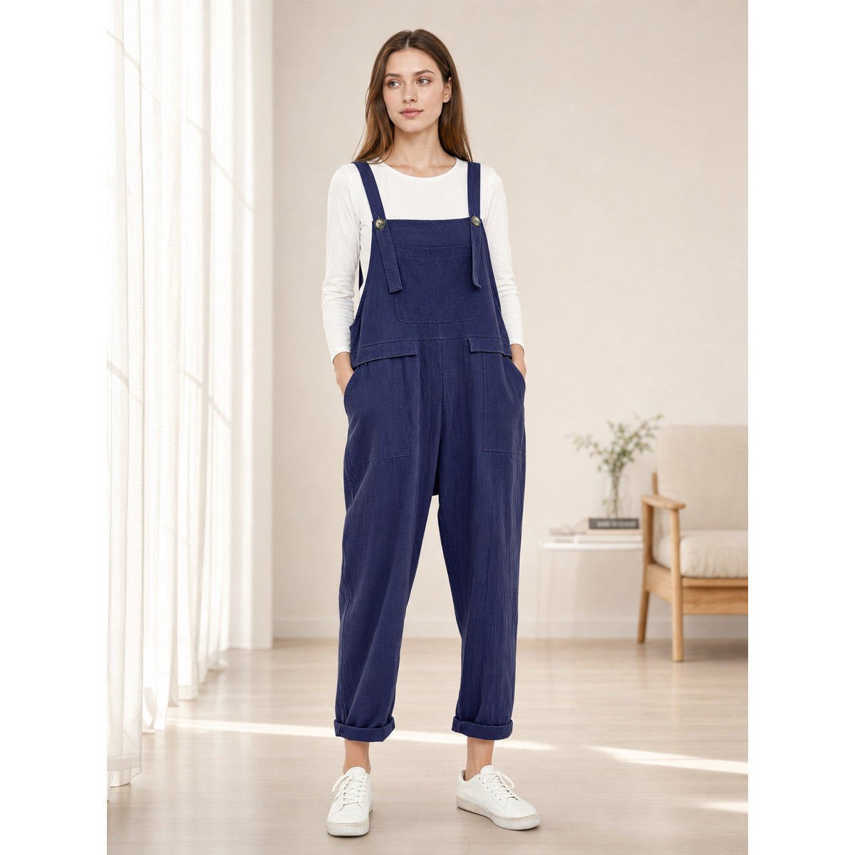 Loose-fit dark navy bib overalls with straps and pockets