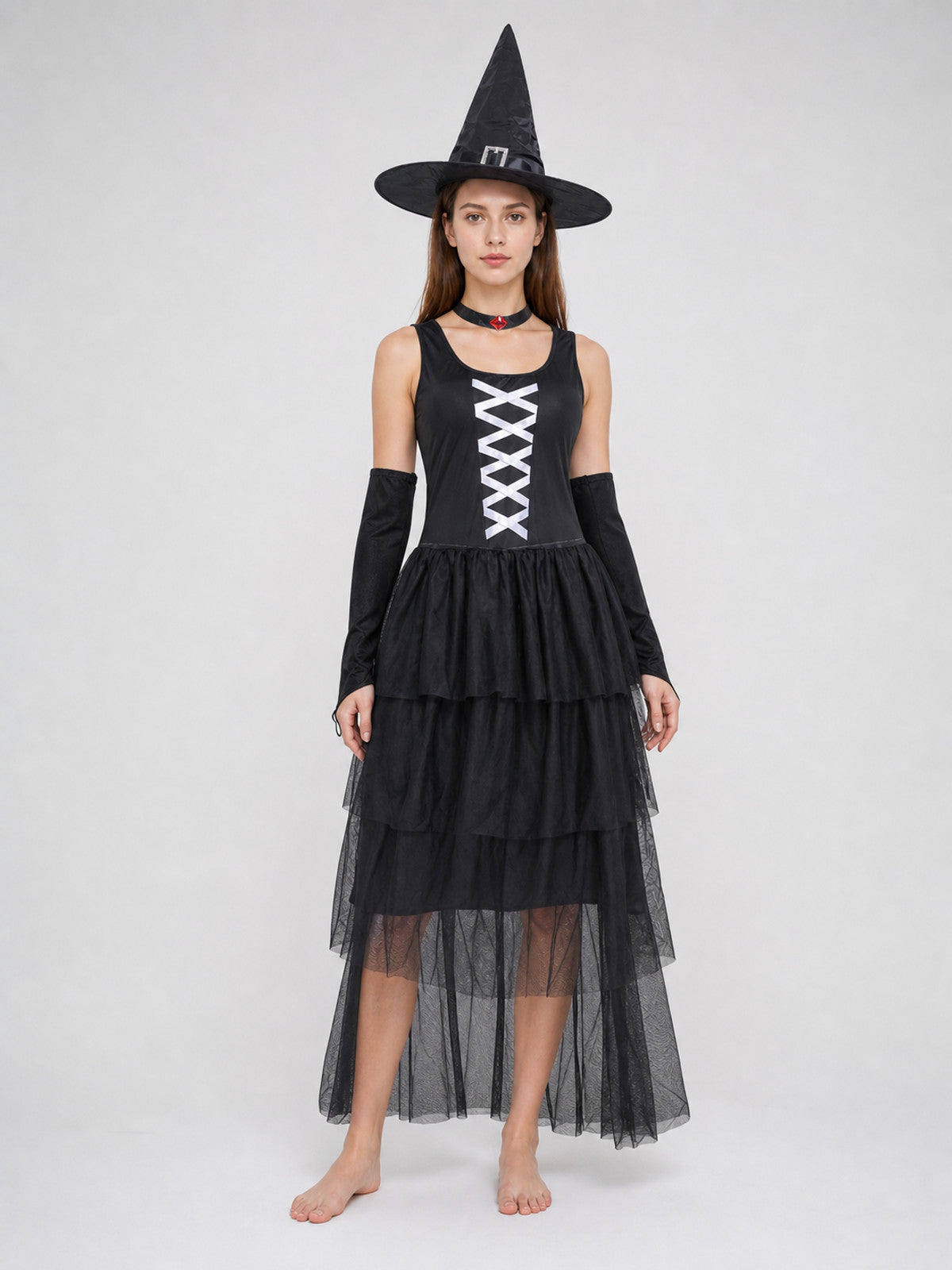 The set includes a black sleeveless dress, a pointed witch hat, separate