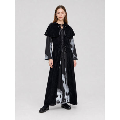 The black witch costume is designed as a long dress with a short shoulder cape. The design features a Halloween theme and is suitable for stage performances, festive events, and themed costumes. The front is decorated with crisscross lacing